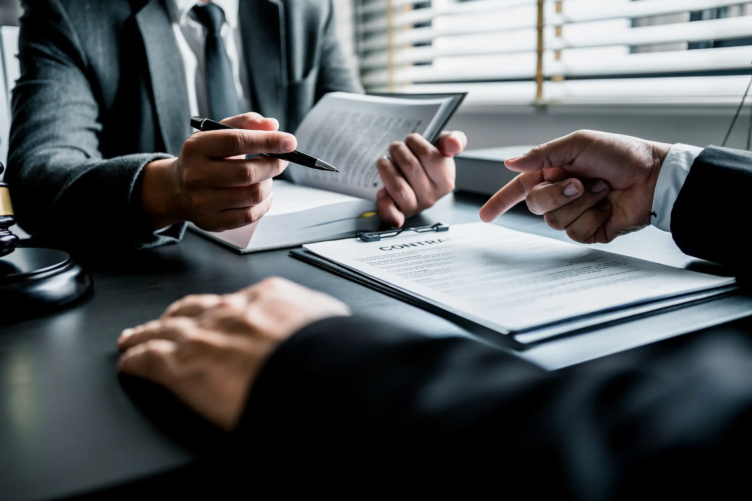 Close Up Of Businessmen Or Lawyers Discussing Contract Or Business Agreement At Law Firm Office, Business People Making Deal Document Legal, Justice Advice Service Concept.